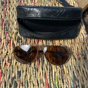 Pre worn Oakley women’s rose gold and tortoise Feedback sunglasses in case.